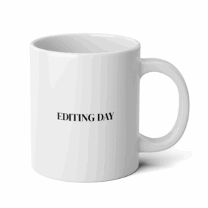 White ceramic coffee mug with black minimalist text that reads “Editing Day,” designed for photographers and creatives